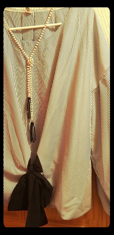 Black and white striped blouse.
